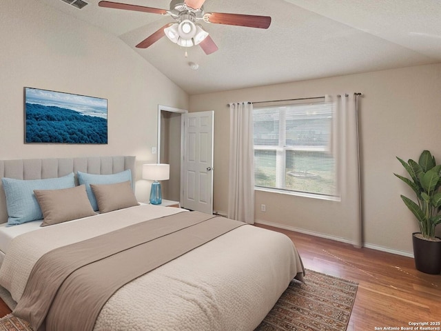 7319 Tranquillo Way, San Antonio, TX 78266 - bedroom with wood finished floors, lofted ceiling, baseboards, and a ceiling fan