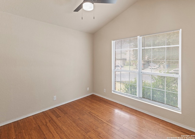 7319 Tranquillo Way, San Antonio, TX 78266 - empty room with wood finished floors, ceiling fan, vaulted ceiling, and baseboards