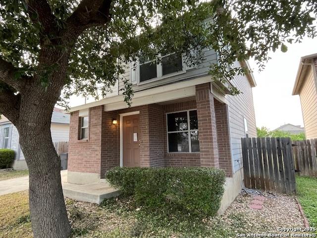 6723 Dragway Farm, San Antonio, TX 78239 - view of front facade with brick siding