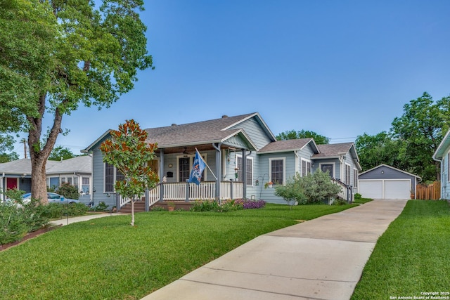 2045 W Mistletoe Ave, San Antonio, TX 78201 - view of front of home with a porch, an outdoor structure, a front lawn, and a garage