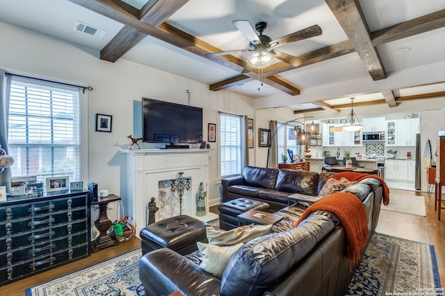 2045 W Mistletoe Ave, San Antonio, TX 78201 - living room with coffered ceiling, a ceiling fan, light wood-style flooring, and beam ceiling