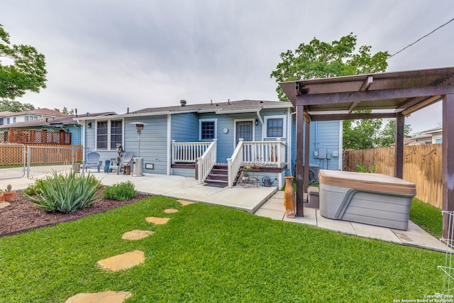 2045 W Mistletoe Ave, San Antonio, TX 78201 - back of house with a hot tub, a patio, and a deck