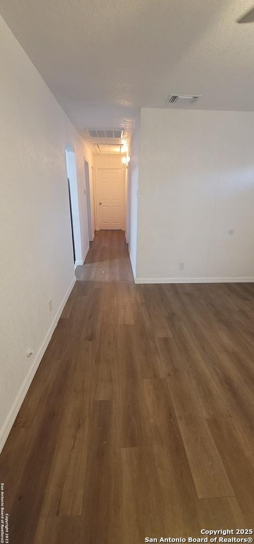 359 Revlon, San Antonio, TX 78227 - hall featuring baseboards and dark wood finished floors