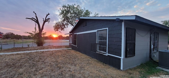 359 Revlon, San Antonio, TX 78227 - property exterior at dusk with central AC
