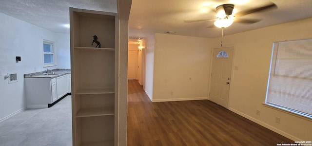 359 Revlon, San Antonio, TX 78227 - kitchen featuring open shelves, a ceiling fan, a sink, baseboards, and white cabinets
