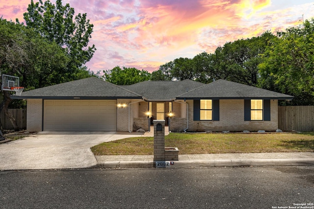 2002 Encino Vly, San Antonio, TX 78259 - ranch-style home featuring an attached garage, concrete driveway, brick siding, and a shingled roof