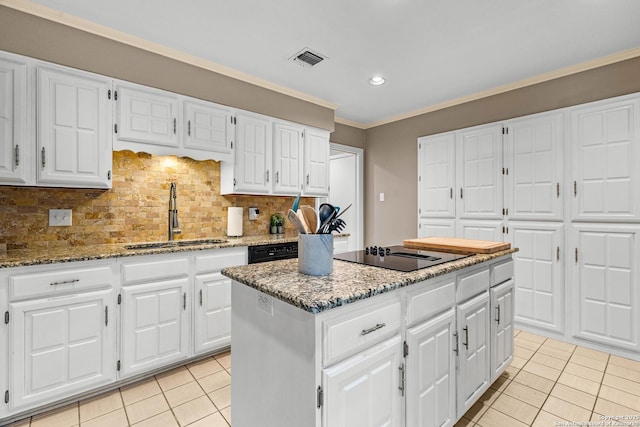 2002 Encino Vly, San Antonio, TX 78259 - kitchen with a sink, light tile patterned floors, a center island, light stone countertops, and recessed lighting