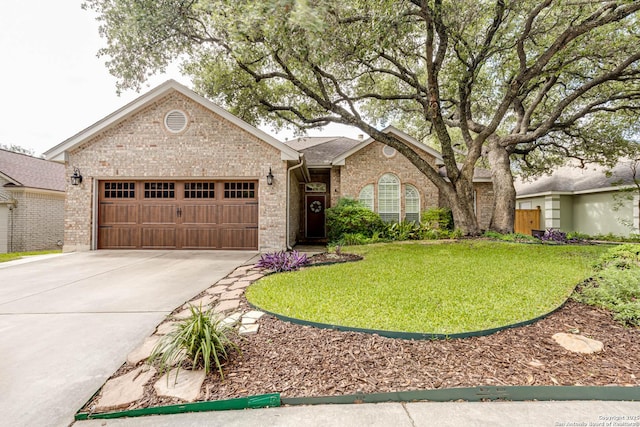 6502 Amber Oak, San Antonio, TX 78249 - ranch-style home with an attached garage, concrete driveway, brick siding, and a front yard
