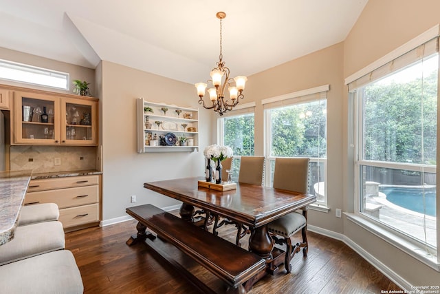 6502 Amber Oak, San Antonio, TX 78249 - dining area with a chandelier, dark wood-style floors, and baseboards
