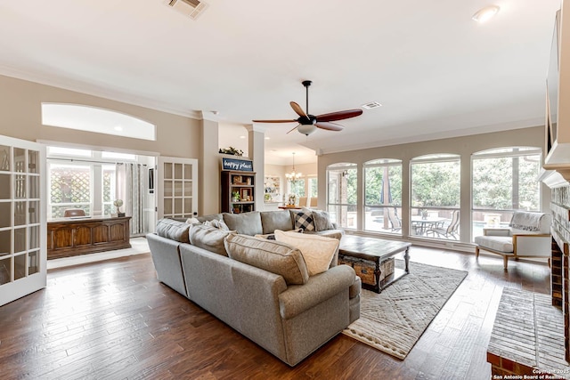 6502 Amber Oak, San Antonio, TX 78249 - living room featuring plenty of natural light, a ceiling fan, a chandelier, wood-type flooring, and crown molding