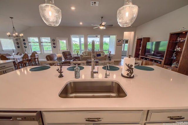 14815 Highdere, San Antonio, TX 78245 - kitchen with open floor plan, dishwashing machine, light countertops, a ceiling fan, and decorative light fixtures