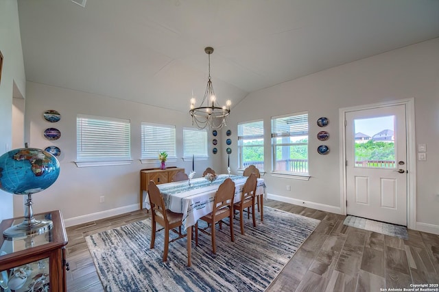 14815 Highdere, San Antonio, TX 78245 - dining room featuring a chandelier, vaulted ceiling, wood finished floors, and baseboards