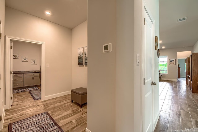 14815 Highdere, San Antonio, TX 78245 - hallway featuring light wood finished floors, baseboards, and recessed lighting