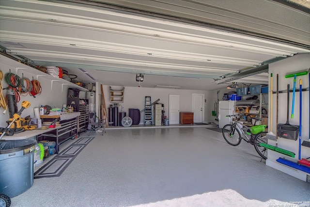 14815 Highdere, San Antonio, TX 78245 - garage with freestanding refrigerator and a garage door opener