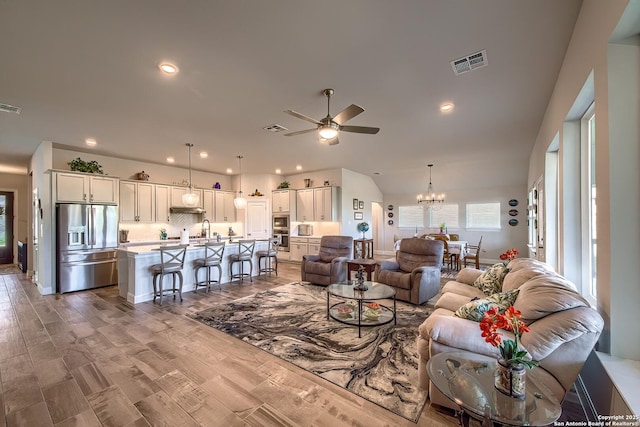 14815 Highdere, San Antonio, TX 78245 - living area featuring a ceiling fan, a chandelier, and recessed lighting