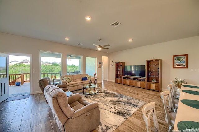 14815 Highdere, San Antonio, TX 78245 - living room featuring light wood finished floors, ceiling fan, baseboards, and recessed lighting