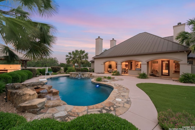 208 Cascade Caverns, Boerne, TX 78015 - pool at dusk with a patio and a pool with connected hot tub