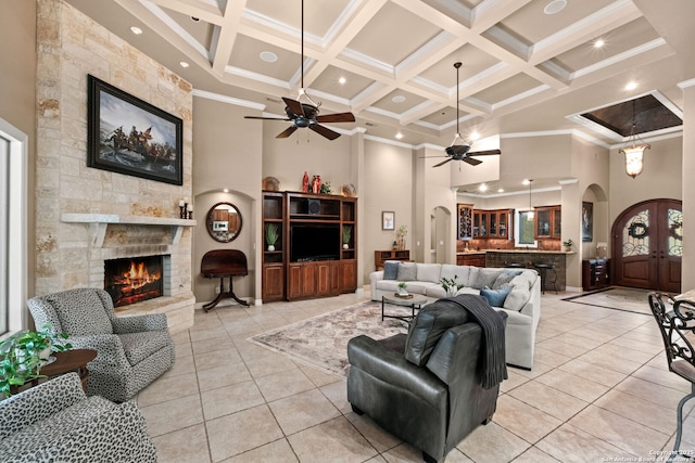 208 Cascade Caverns, Boerne, TX 78015 - living room with ceiling fan, a towering ceiling, arched walkways, coffered ceiling, and a fireplace