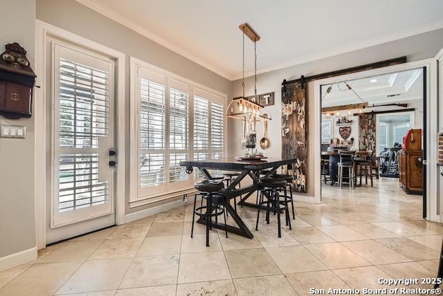 41 Champions Run, San Antonio, TX 78258 - dining space with a barn door, crown molding, light tile patterned flooring, and baseboards