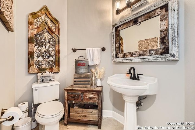 41 Champions Run, San Antonio, TX 78258 - half bathroom featuring baseboards, toilet, and tile patterned flooring