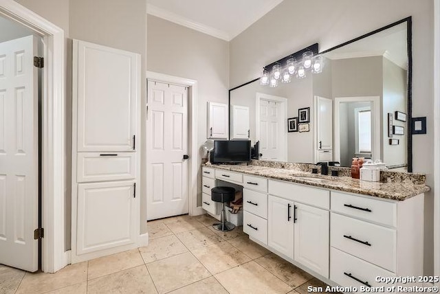 41 Champions Run, San Antonio, TX 78258 - bathroom featuring ornamental molding, vanity, and tile patterned flooring