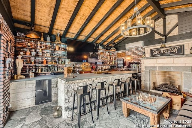 41 Champions Run, San Antonio, TX 78258 - indoor bar featuring a chandelier, wood ceiling, and a fireplace