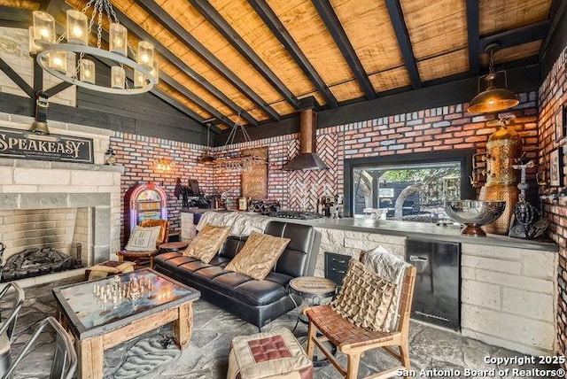 41 Champions Run, San Antonio, TX 78258 - living area with brick wall, wooden ceiling, a fireplace, and a chandelier