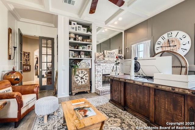41 Champions Run, San Antonio, TX 78258 - home office with coffered ceiling, light wood-style floors, a ceiling fan, beamed ceiling, and a fireplace