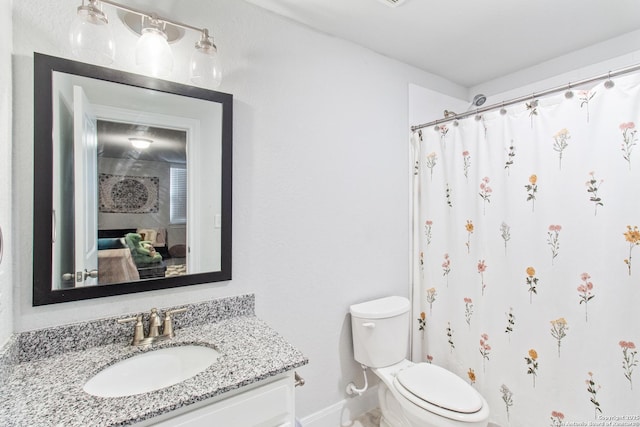12815 Fort Belknap, San Antonio, TX 78245 - full bath featuring vanity, toilet, baseboards, and curtained shower