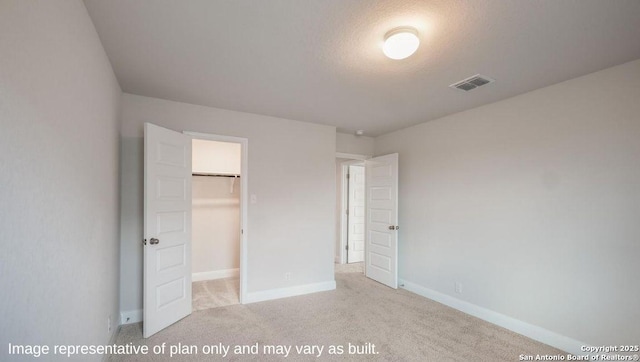 21055 Millstream Bnd, San Antonio, TX 78266 - unfurnished bedroom with carpet, a spacious closet, baseboards, and a closet
