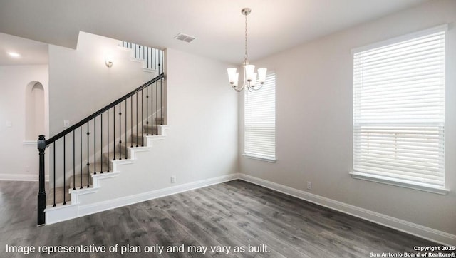 21055 Millstream Bnd, San Antonio, TX 78266 - stairway with wood finished floors, a chandelier, and baseboards