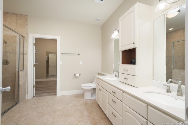 25927 Echo Mtn, San Antonio, TX 78260 - full bathroom featuring double vanity, a stall shower, baseboards, tile patterned flooring, and toilet