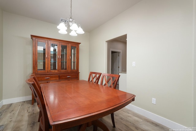 25927 Echo Mtn, San Antonio, TX 78260 - dining room with light wood-style flooring, a chandelier, and baseboards