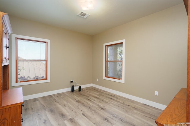 25927 Echo Mtn, San Antonio, TX 78260 - unfurnished room with plenty of natural light, light wood finished floors, and baseboards