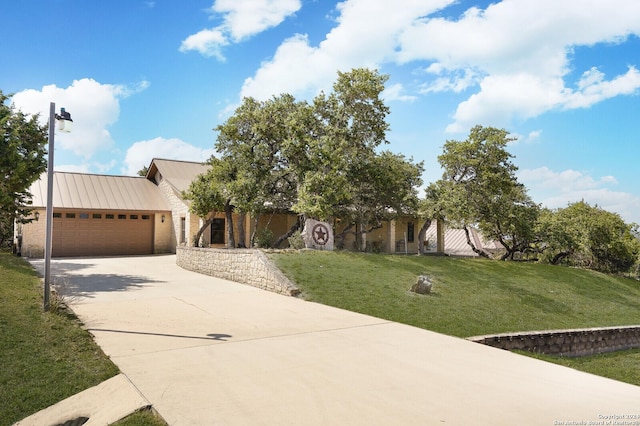25927 Echo Mtn, San Antonio, TX 78260 - view of front of house with concrete driveway, a garage, a front lawn, and metal roof