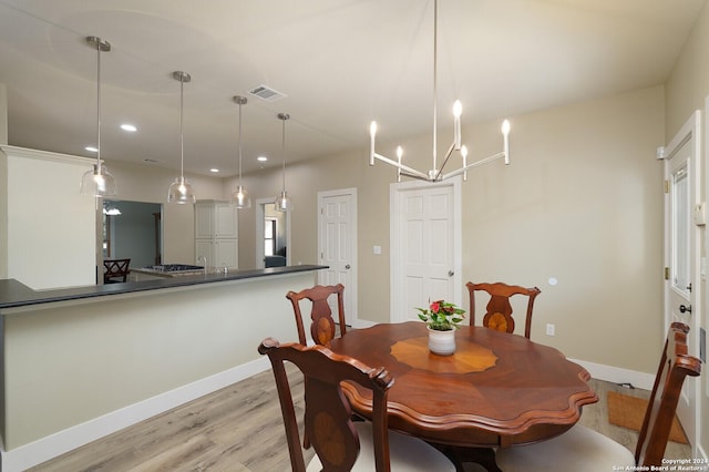 25927 Echo Mtn, San Antonio, TX 78260 - dining space with light wood finished floors, baseboards, a chandelier, and recessed lighting
