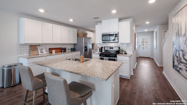 14623 Clay Ridge Run, San Antonio, TX 78253 - kitchen with appliances with stainless steel finishes, a sink, decorative backsplash, baseboards, and dark wood finished floors