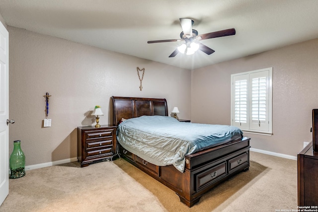11334 Luckey Ledge, San Antonio, TX 78252 - bedroom featuring light colored carpet, baseboards, and a ceiling fan