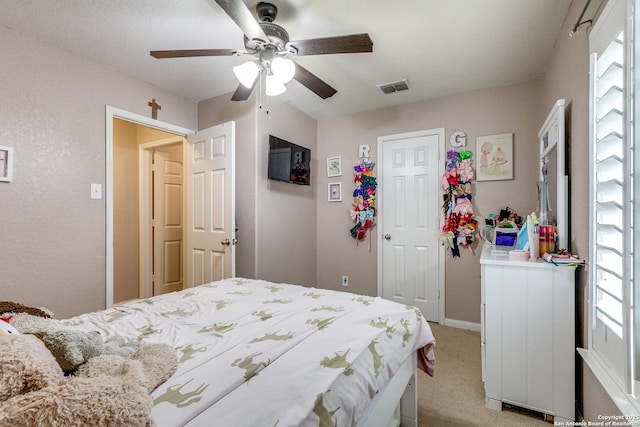 11334 Luckey Ledge, San Antonio, TX 78252 - bedroom featuring light carpet, ceiling fan, and a closet