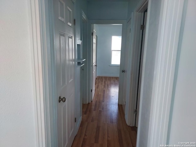 811 N Archer, Beeville, TX 78102 - corridor with dark wood-style floors and baseboards