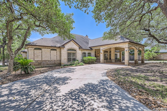 5718 Elam Way, San Antonio, TX 78261 - french provincial home with stone siding, driveway, and roof with shingles