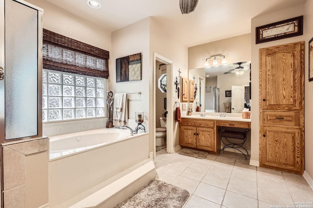 5718 Elam Way, San Antonio, TX 78261 - full bath with a bath, toilet, vanity, tile patterned flooring, and a ceiling fan