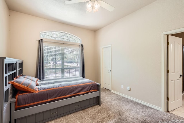 5718 Elam Way, San Antonio, TX 78261 - bedroom featuring light carpet, baseboards, and a ceiling fan