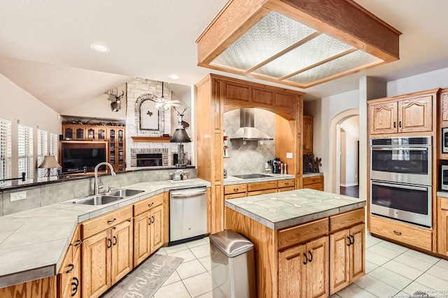 5718 Elam Way, San Antonio, TX 78261 - kitchen with appliances with stainless steel finishes, a sink, wall chimney range hood, light tile patterned floors, and recessed lighting