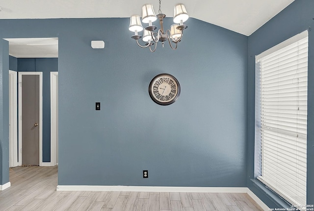 8810 Pensive, Converse, TX 78109 - empty room with a chandelier, wood finished floors, baseboards, and lofted ceiling