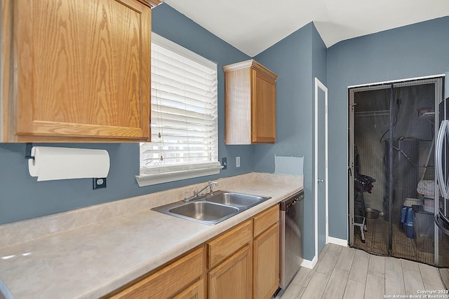 8810 Pensive, Converse, TX 78109 - kitchen featuring dishwasher, a sink, light countertops, baseboards, and wood tiled floors