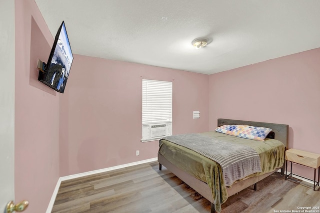 8810 Pensive, Converse, TX 78109 - bedroom with light wood-style floors, cooling unit, and baseboards