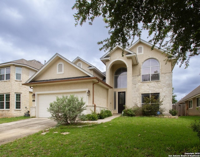 8219 Wayside Crk, San Antonio, TX 78255 - traditional home with a front yard, driveway, an attached garage, and stucco siding