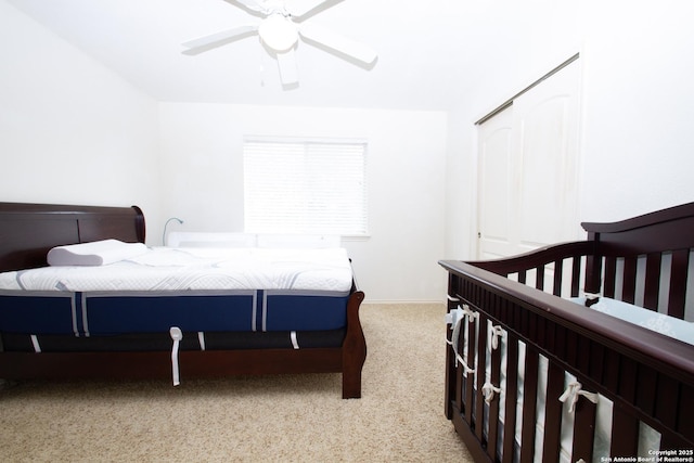 8219 Wayside Crk, San Antonio, TX 78255 - bedroom with light carpet, a ceiling fan, and a closet