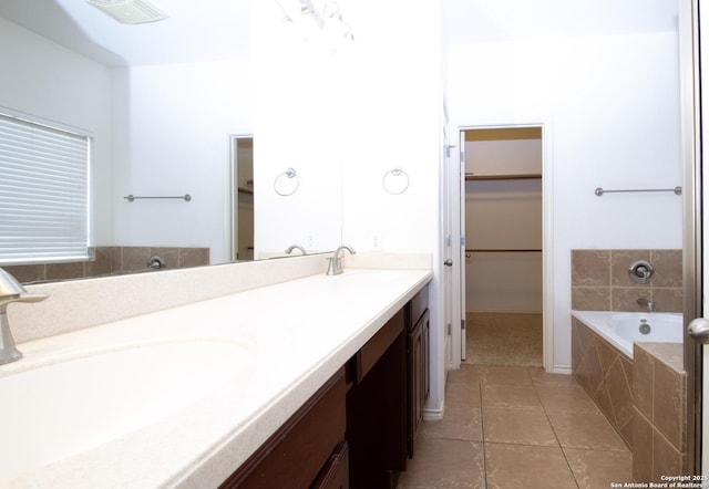 8219 Wayside Crk, San Antonio, TX 78255 - bathroom with a bath, a spacious closet, double vanity, and tile patterned floors